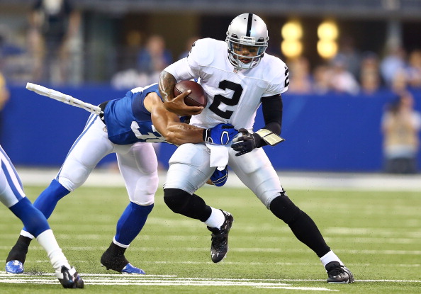 INDIANAPOLIS, IN - SEPTEMBER 08:  Terrelle Pryor #2 of the Oakland Raiders runs with the ball while defended by LaRon Landry #30 of the Indianapolis Colts during the game at Lucas Oil Stadium on September 8, 2013 in Indianapolis, Indiana.  (Photo by Andy Lyons/Getty Images)