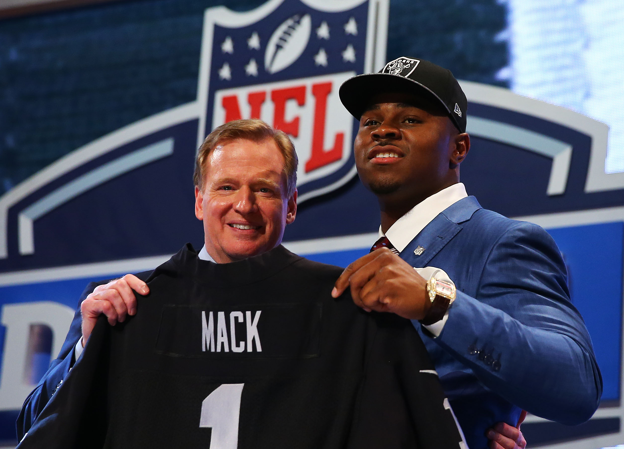 NEW YORK, NY - MAY 08: Khalil Mack of the Buffalo Bulls poses with NFL Commissioner Roger Goodell after he was picked #5 overall by the Oakland Raiders during the first round of the 2014 NFL Draft at Radio City Music Hall on May 8, 2014 in New York City. (Photo by Elsa/Getty Images)