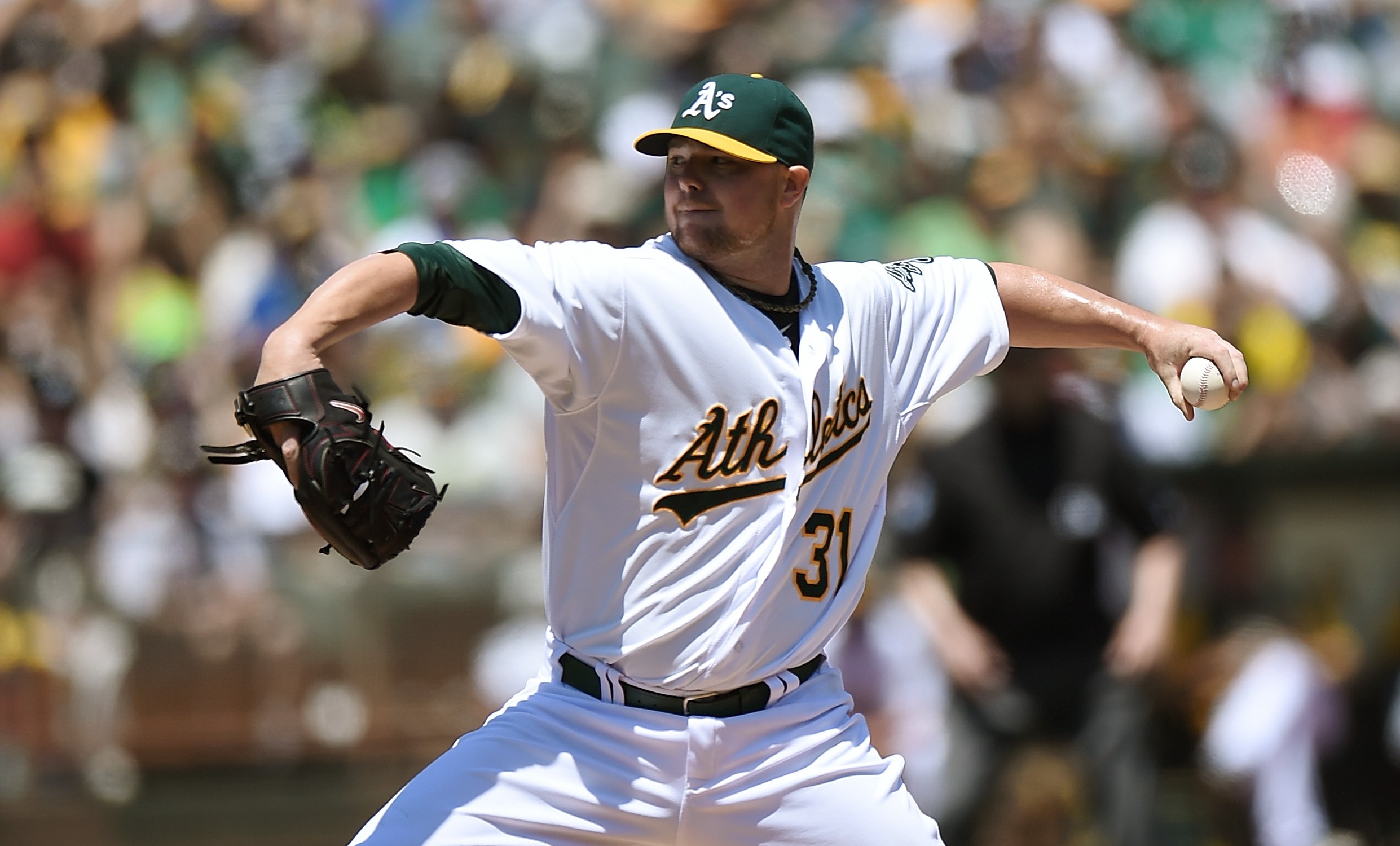 OAKLAND, CA - AUGUST 02:  Jon Lester #31 of the Oakland Athletics pitches against the Kansas City Royals in the top of the second inning at O.co Coliseum on August 2, 2014 in Oakland, California.  (Photo by Thearon W. Henderson/Getty Images)