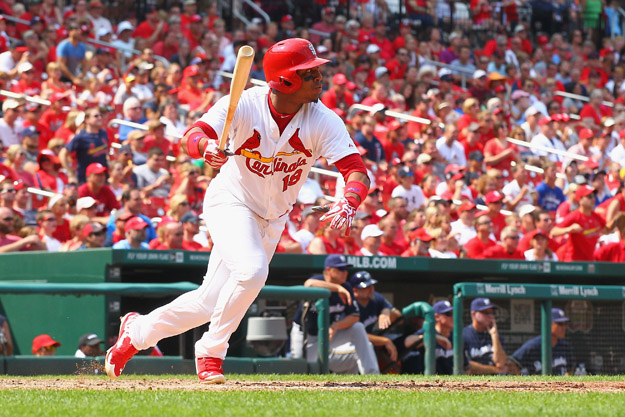 ST. LOUIS, MO - AUGUST 3:  Oscar Taveras #18 of the St. Louis Cardinals hits what would be the game-winning RBI single against the Milwaukee Brewers in the seventh inning at Busch Stadium on August 3, 2014 in St. Louis, Missouri.  The Cardinals beat the Brewers 3-2.  