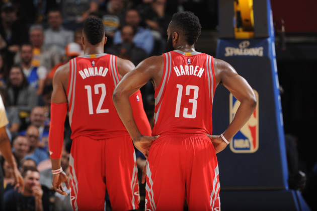 Dwight Howard #12 and James Harden #13 of the Houston Rockets while facing the Golden State Warriors.