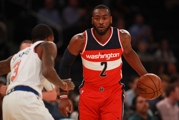 John Wall #2 of the Washington Wizards dribbles up court against Brandon Jennings #3 of the New York Knicks in the first half of the preseason game at Madison Square Garden on October 10, 2016 in New York City.