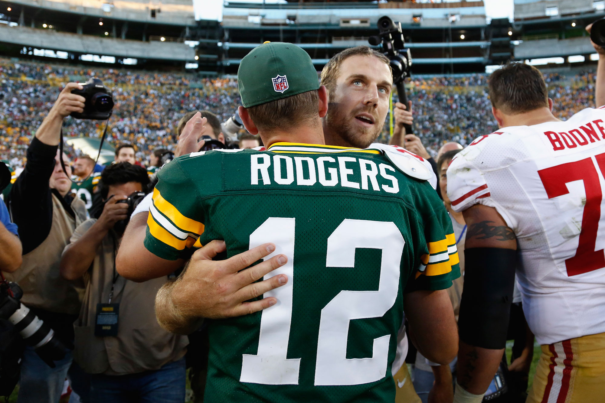 Alex Smith #11 of the San Francisco 49ers hugs Aaron Rodgers #12 of the Green Bay Packers after the game at Lambeau Field on September 9, 2012 in Green Bay, Wisconsin. The 49ers won 30-22. (Photo by Joe Robbins/Getty Images)