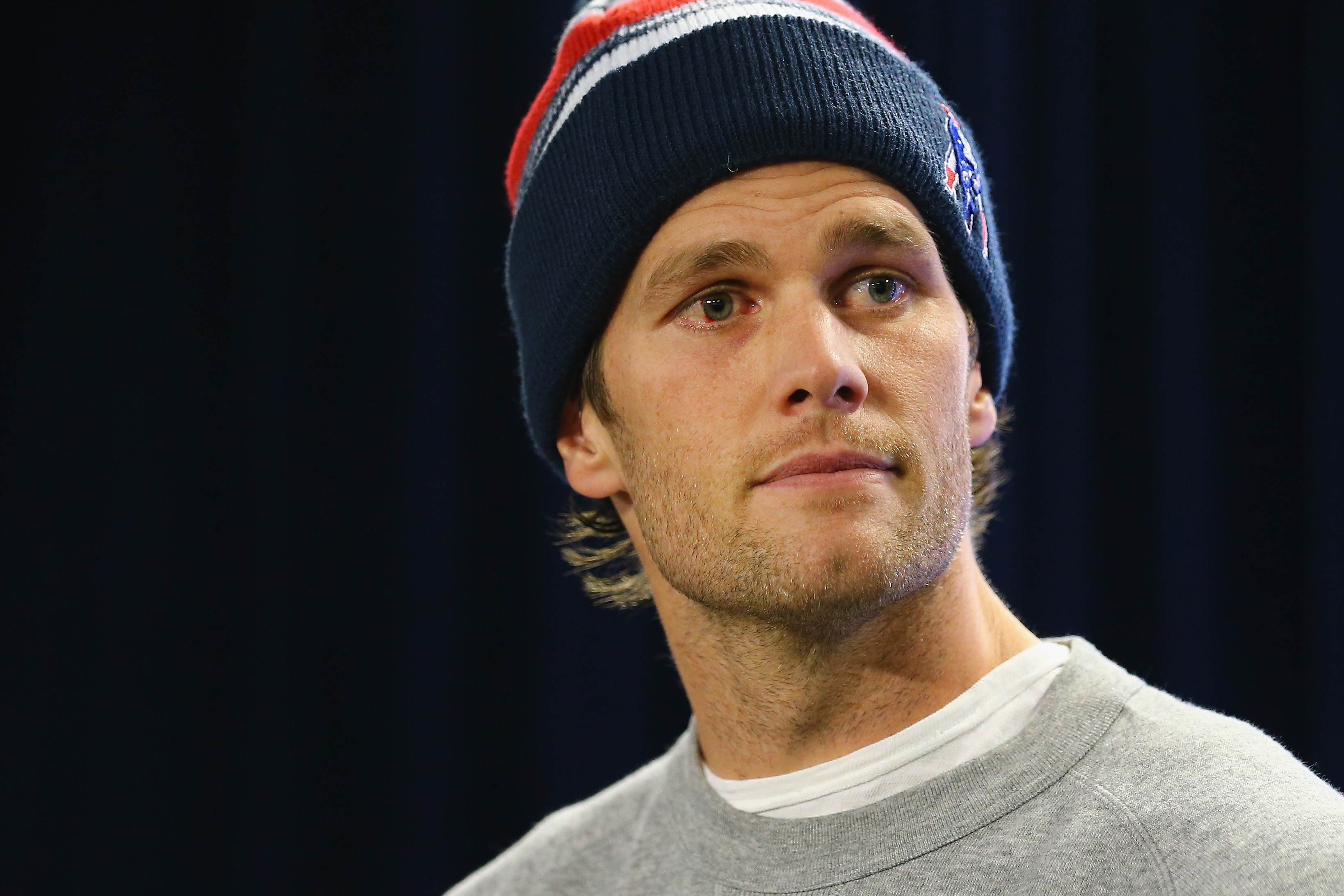 FOXBORO, MA - JANUARY 22: New England Patriots Quarterback Tom Brady talks to the media during a press conference to address the under inflation of footballs used in the AFC championship game at Gillette Stadium on January 22, 2015 in Foxboro, Massachusetts.  