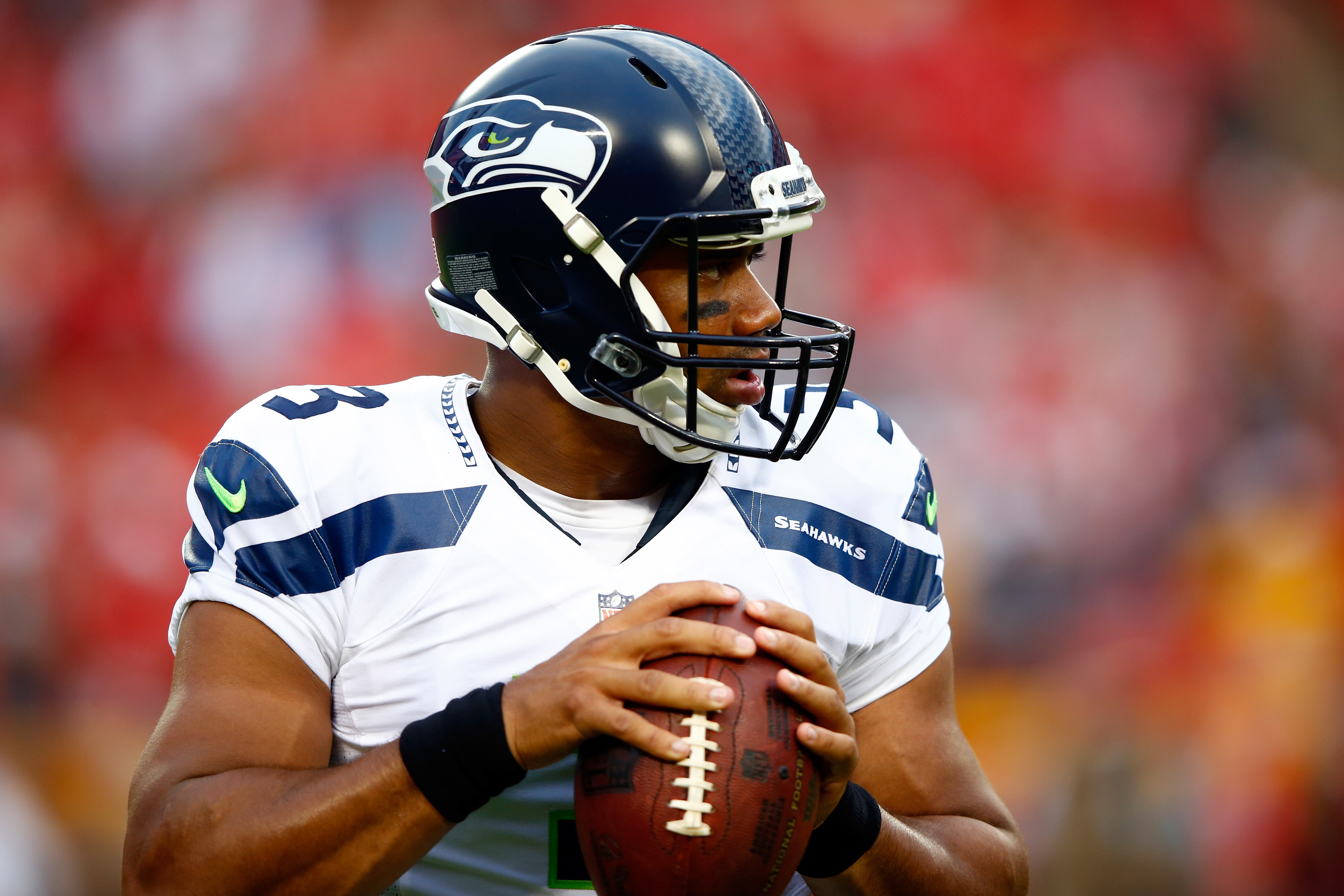 KANSAS CITY, MO - AUGUST 21: Quarterback Russell Wilson #3 of the Seattle Seahawks warms up prior to the preaseason game against the Kansas City Chiefs at Arrowhead Stadium on August 21, 2015 in Kansas City, Missouri.