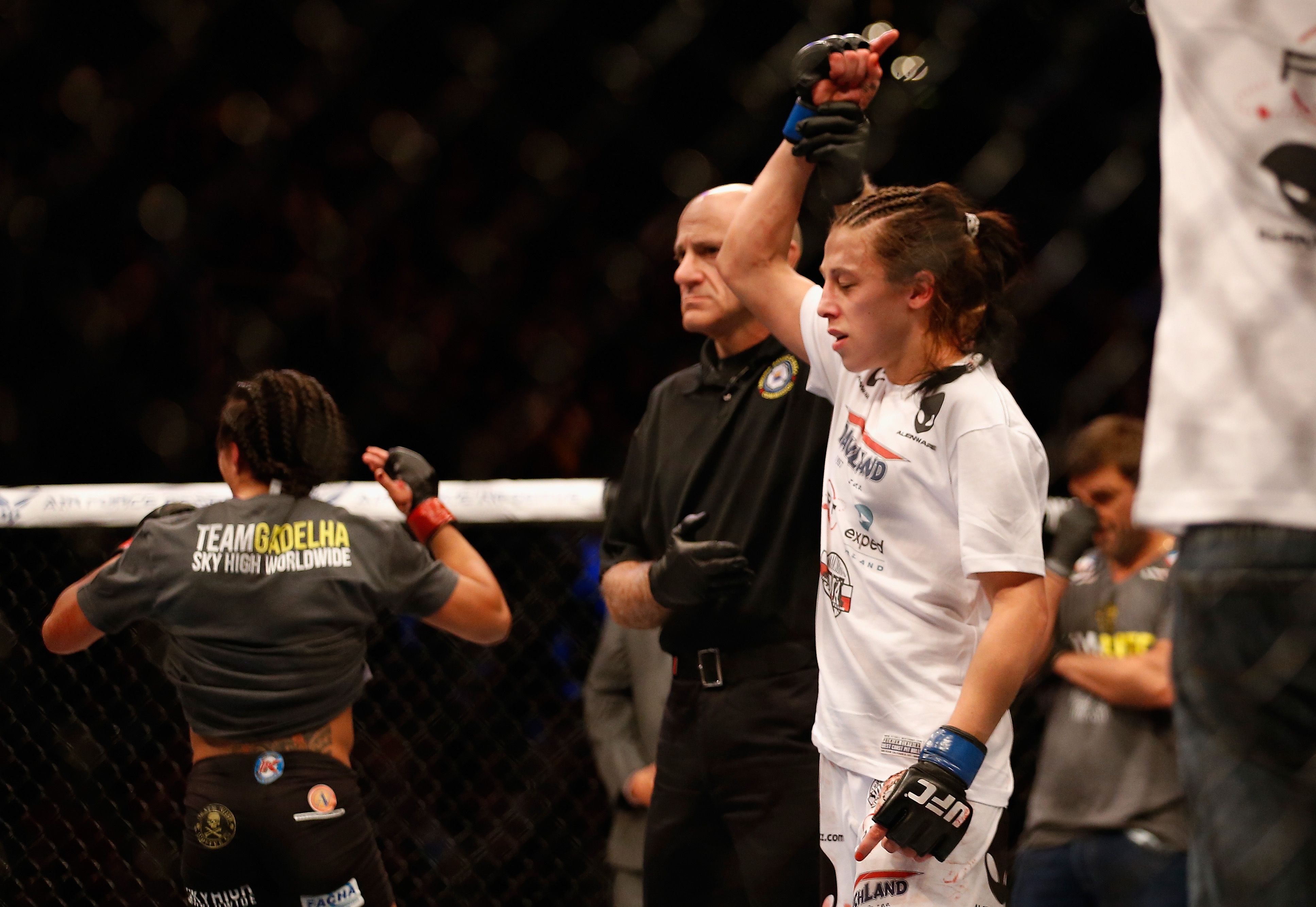 PHOENIX, AZ - DECEMBER 13: Joanna Jedrzejczyk (R) celebrates her victory by decision over Claudia Gadelha in their women's strawweight bout during the UFC Fight Night event at the at U.S. Airways Center on December 13, 2014 in Phoenix, Arizona. (Photo by Christian Petersen/Getty Images)