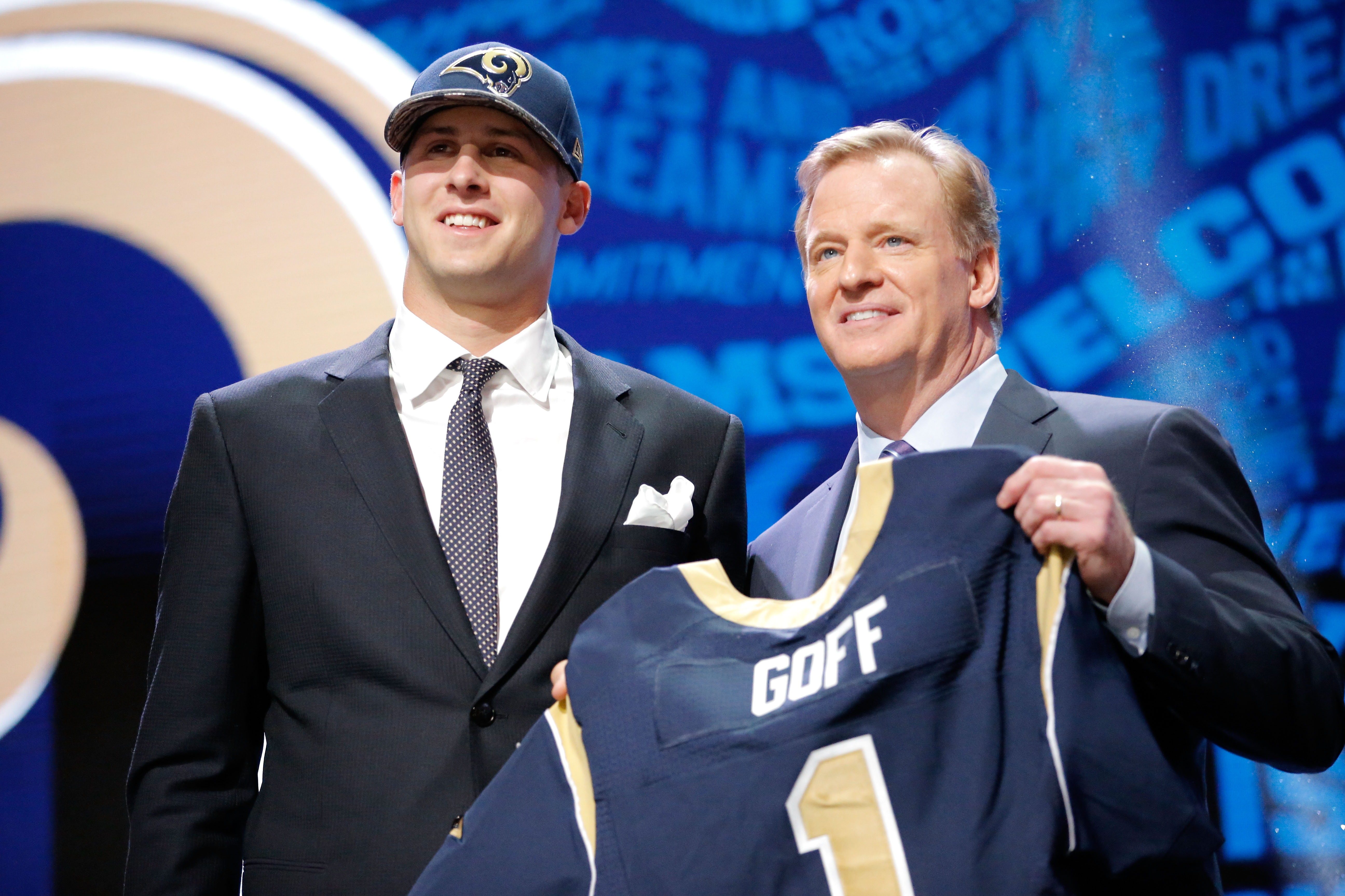 CHICAGO, IL - APRIL 28:  (L-R) Jared Goff of the California Golden Bears holds up a jersey with NFL Commissioner Roger Goodell after being picked #1 overall by the Los Angeles Rams during the first round of the 2016 NFL Draft at the Auditorium Theatre of Roosevelt University on April 28, 2016 in Chicago, Illinois.  (Photo by Jon Durr/Getty Images)