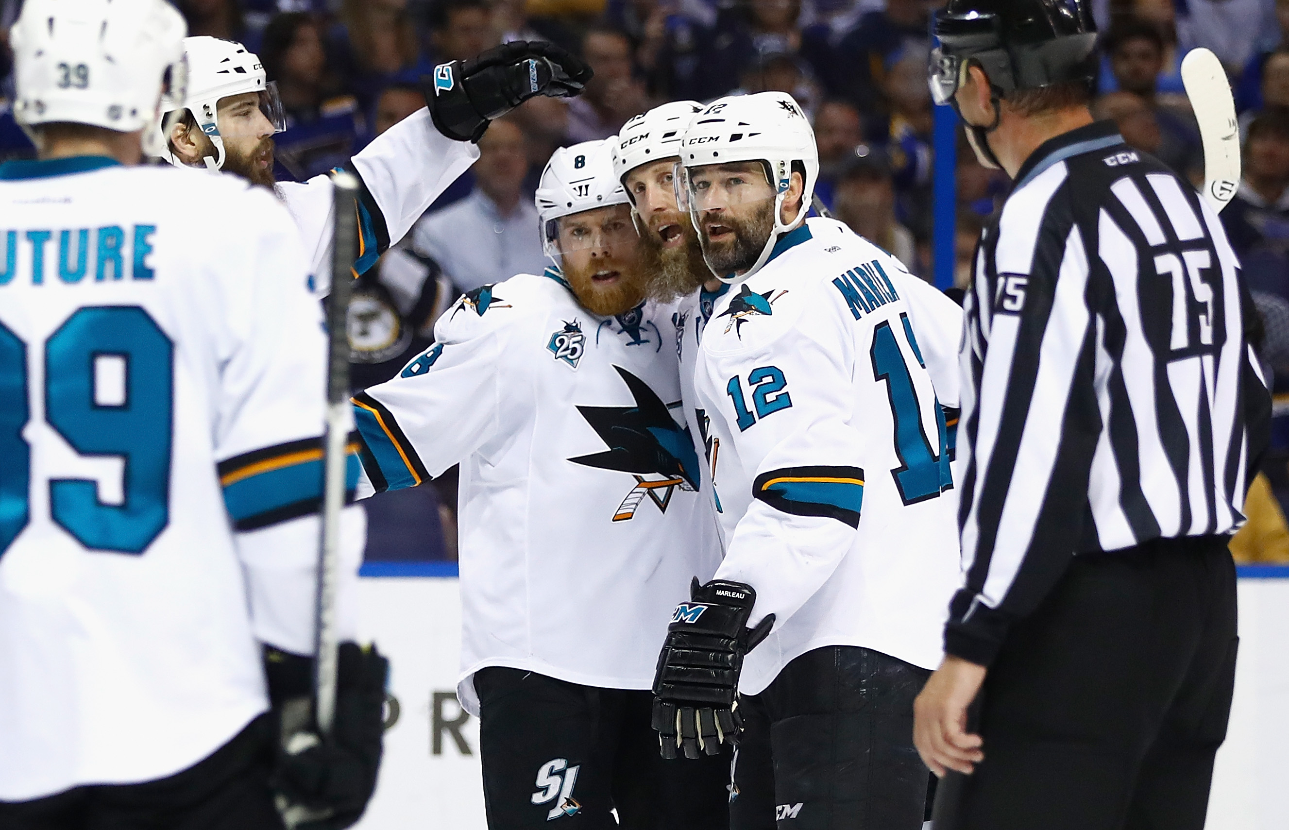 ST LOUIS, MO - MAY 23: Joe Pavelski #8 of the San Jose Sharks celebrates with Joe Thornton #19, Patrick Marleau #12 and Brent Burns #88 after scoring a second period goal against the St. Louis Blues in Game Five of the Western Conference Final during the 2016 NHL Stanley Cup Playoffs at Scottrade Center on May 23, 2016 in St Louis, Missouri.