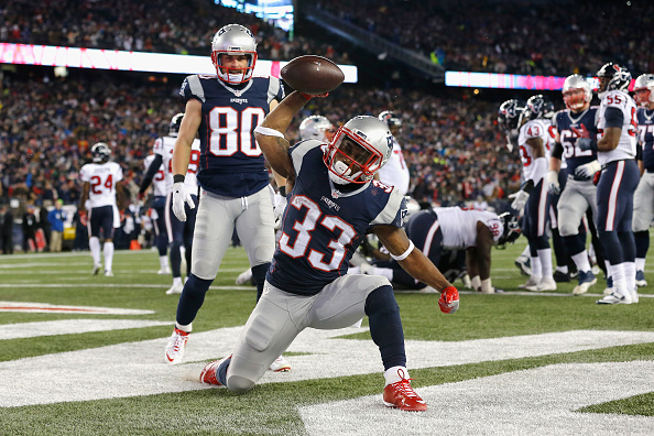 FOXBORO, MA - JANUARY 14:  Dion Lewis #33 of the New England Patriots celebrates after scoring a touchdown in the fourth quarter against the Houston Texans during the AFC Divisional Playoff Game at Gillette Stadium on January 14, 2017 in Foxboro, Massachusetts.  (Photo by Jim Rogash/Getty Images)