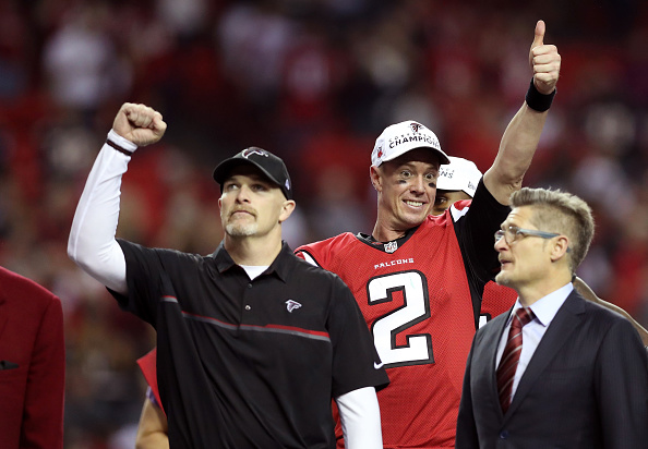 ATLANTA, GA - JANUARY 22:  Matt Ryan #2 and head coach Dan Quinn of the Atlanta Falcons celebrate after defeating the Green Bay Packers in the NFC Championship Game at the Georgia Dome on January 22, 2017 in Atlanta, Georgia. The Falcons defeated the Packers 44-21.  (Photo by Rob Carr/Getty Images)