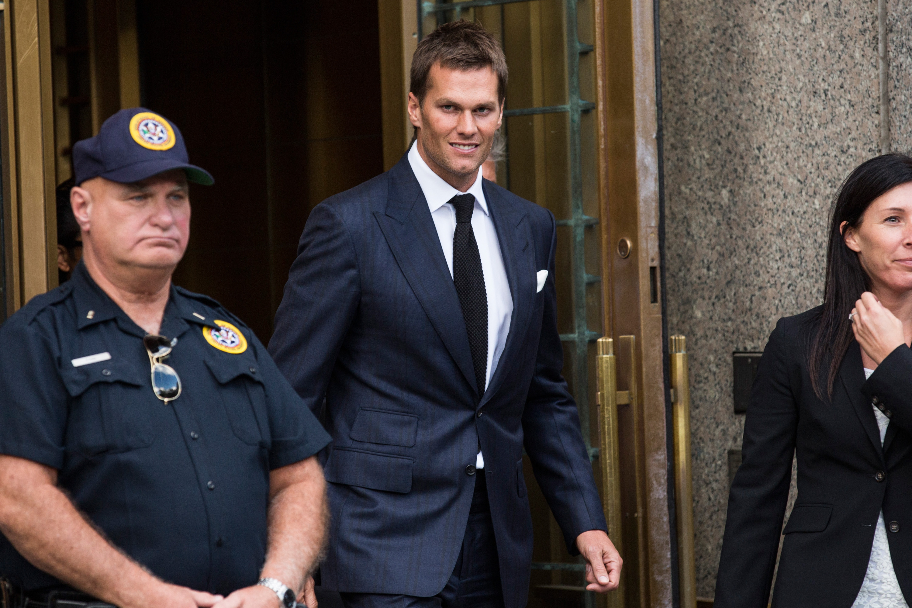 NEW YORK, NY - AUGUST 12: New England Patriots quarterback Tom Brady leaves federal court after appealing the National Football League's (NFL) decision to suspend him for four games of the 2015 season on August 12, 2015 in New York City. The NFL alleges that Brady knew footballs used in one of last season's games was deflated below league standards, making it easier to handle. (Photo by Andrew Burton/Getty Images)