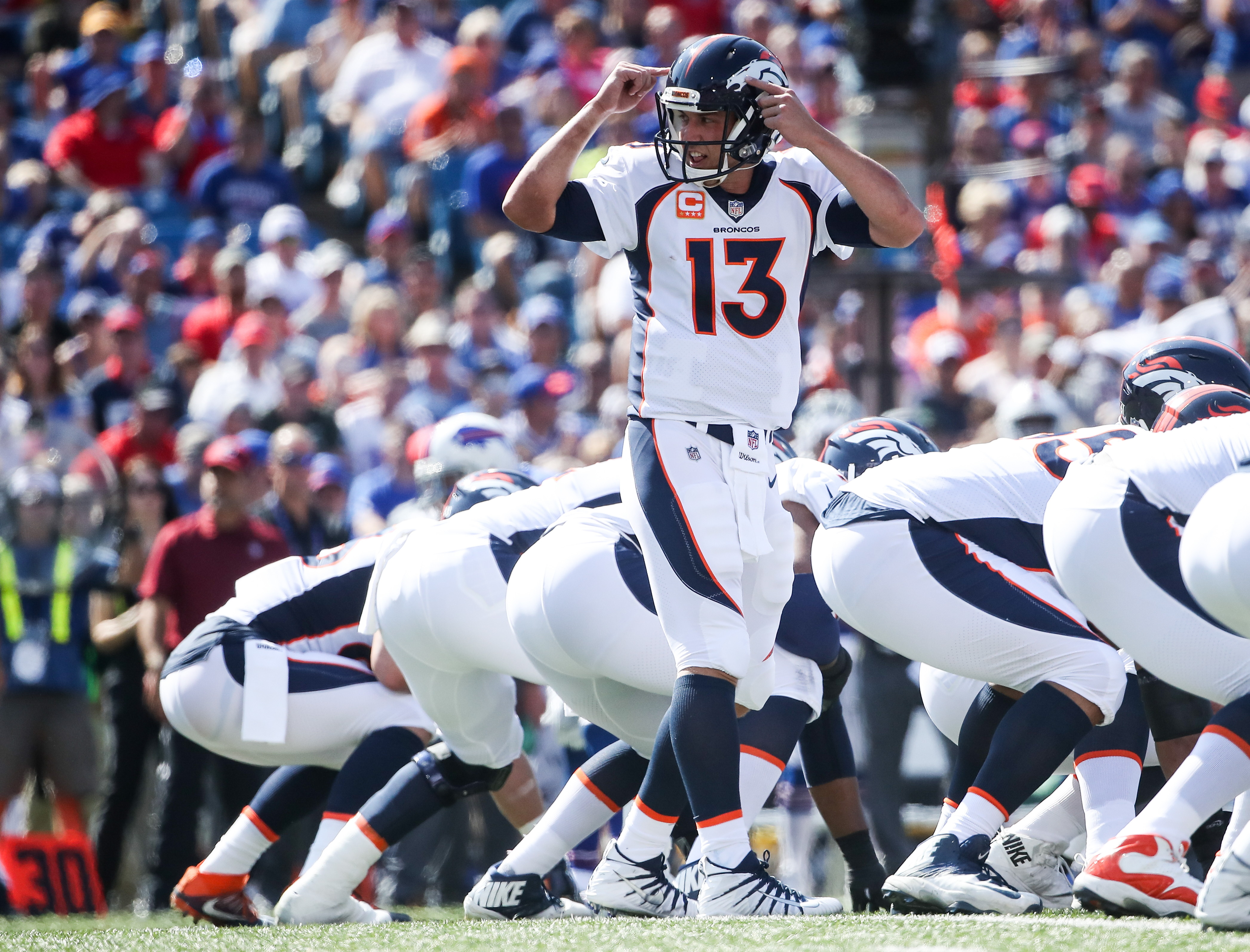 ORCHARD PARK, NY - SEPTEMBER 24: Trevor Siemian #13 of the Denver Broncos makes a signal during an NFL game against the Buffalo Bills on September 24, 2017 at New Era Field in Orchard Park, New York.  