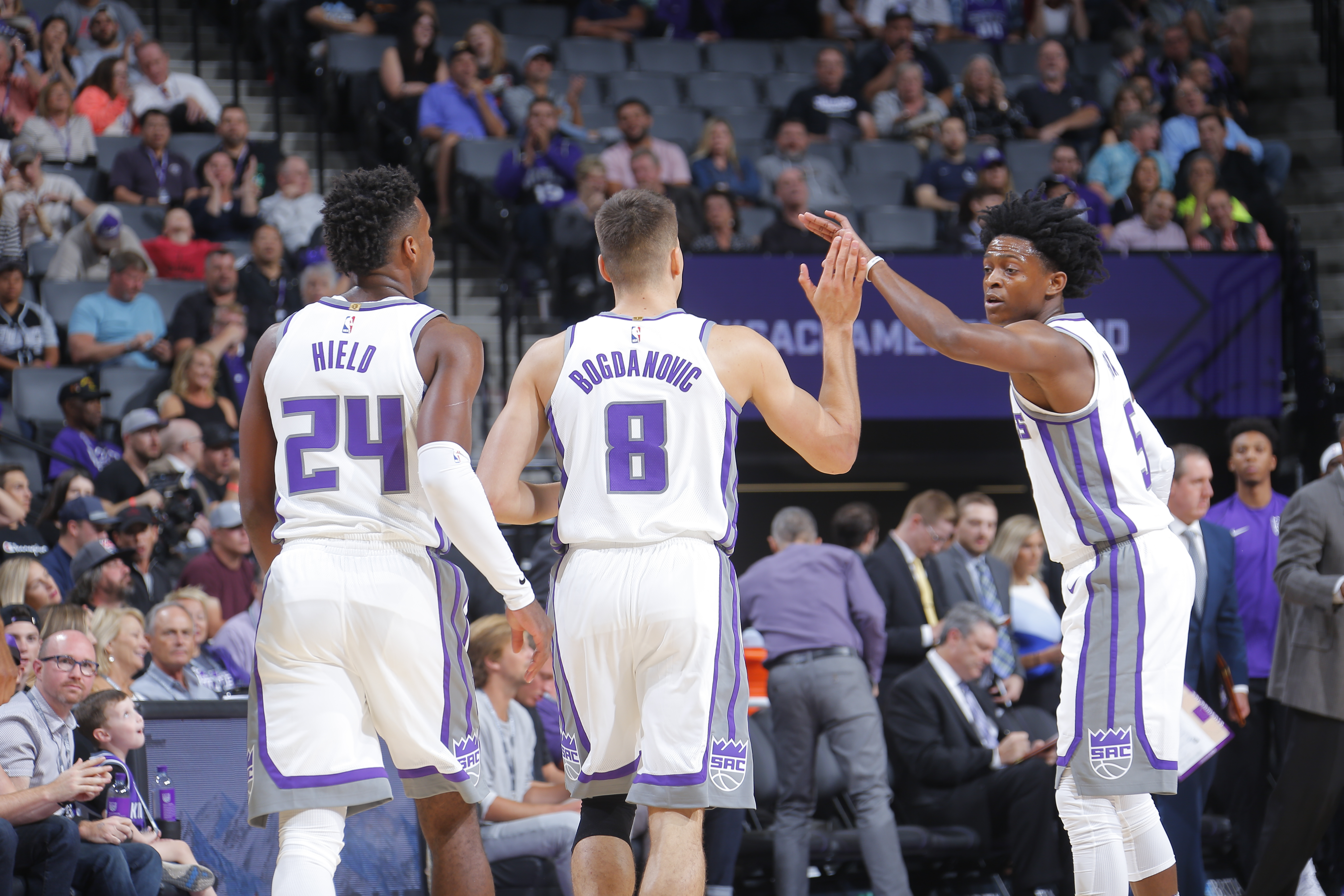SACRAMENTO, CA - OCTOBER 2: De'Aaron Fox #5 of the Sacramento Kings give high fives to teammates during the preseason game against the San Antonio Spurs on October 2, 2017 at Golden 1 Center in Sacramento, California. NOTE TO USER: User expressly acknowledges and agrees that, by downloading and or using this Photograph, user is consenting to the terms and conditions of the Getty Images License Agreement. Mandatory Copyright Notice: Copyright 2017 NBAE