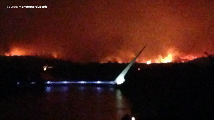 The Carr Fire seen in the distance near the Sundial Bridge on Thursday. (Credit: mommanerdypants/Instagram)