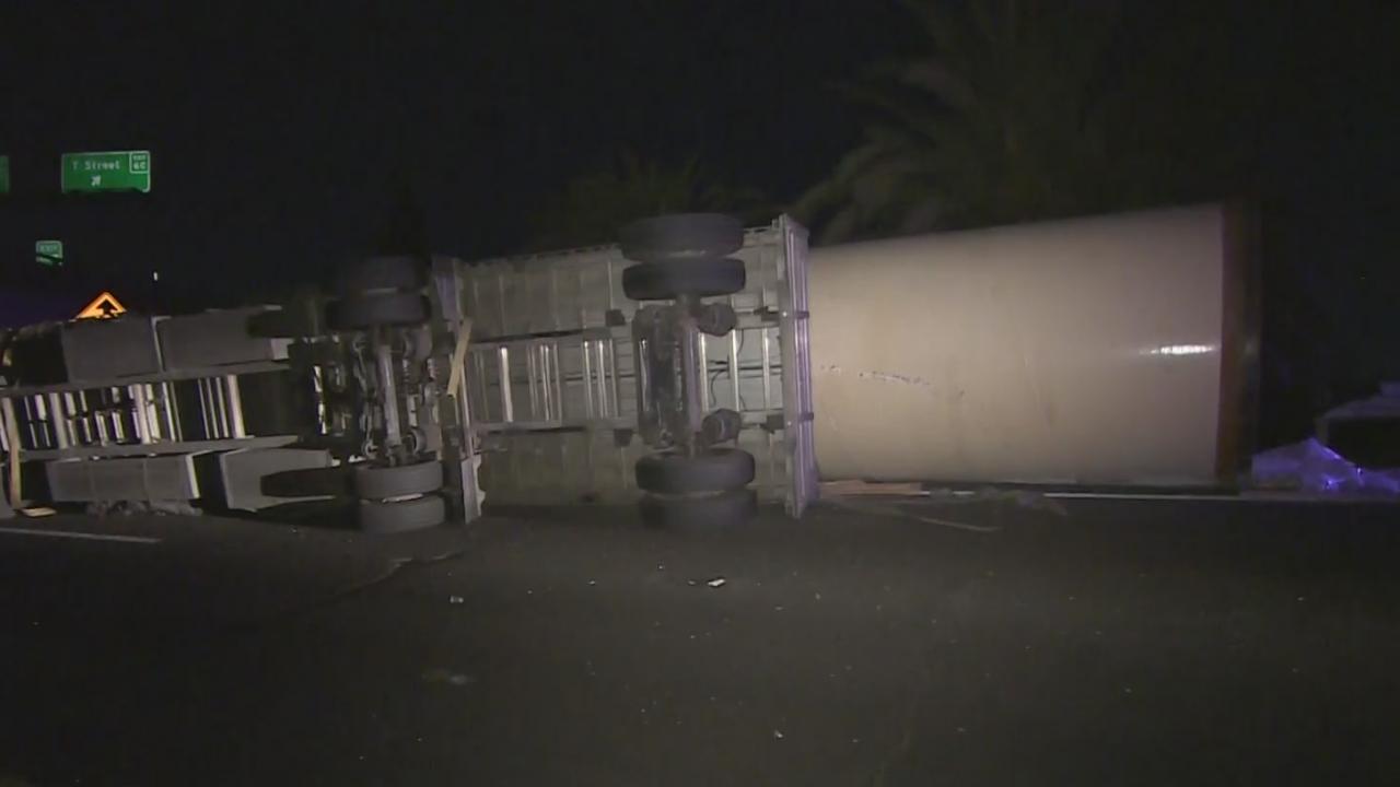 2 Injured After Semi-Truck Carrying Large Pipe Overturns On Highway 99